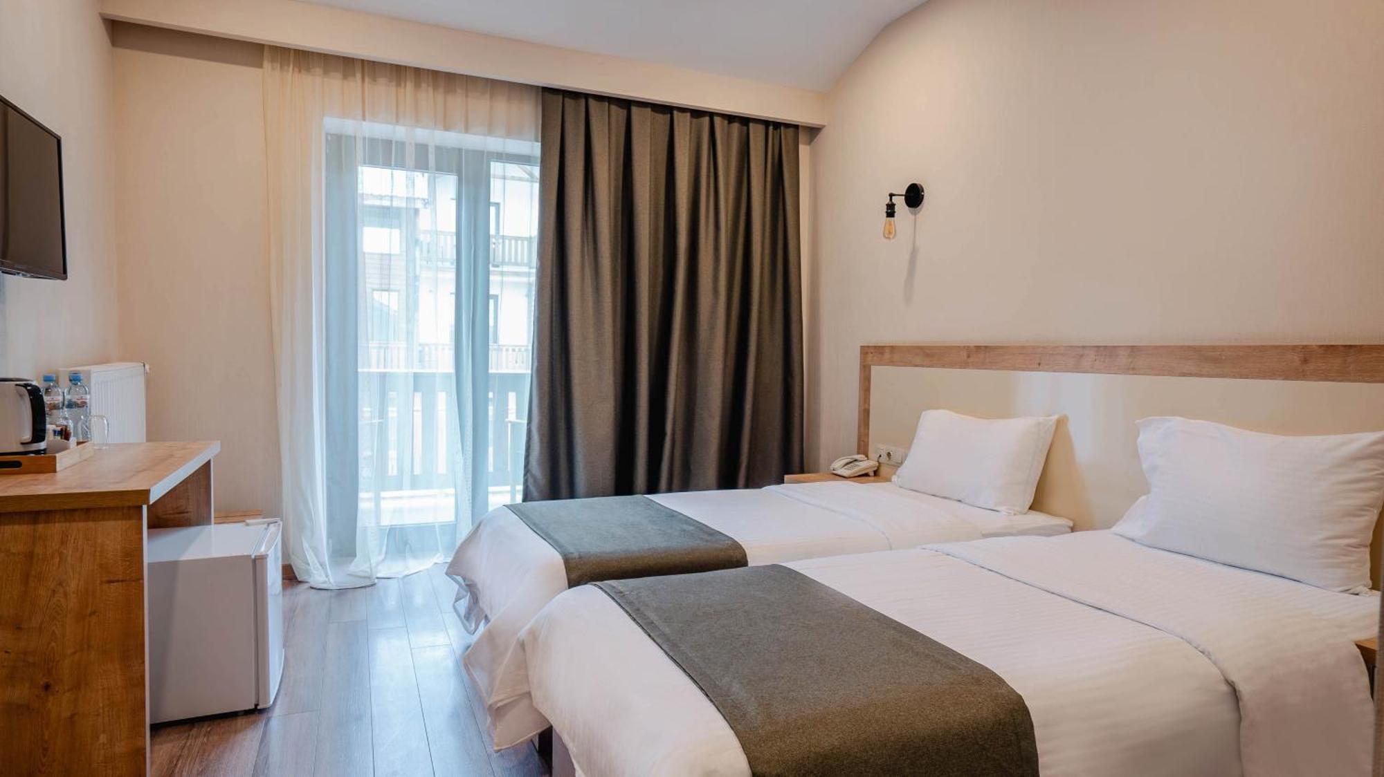 Gudauri Inn Rom bilde A room at the hotel